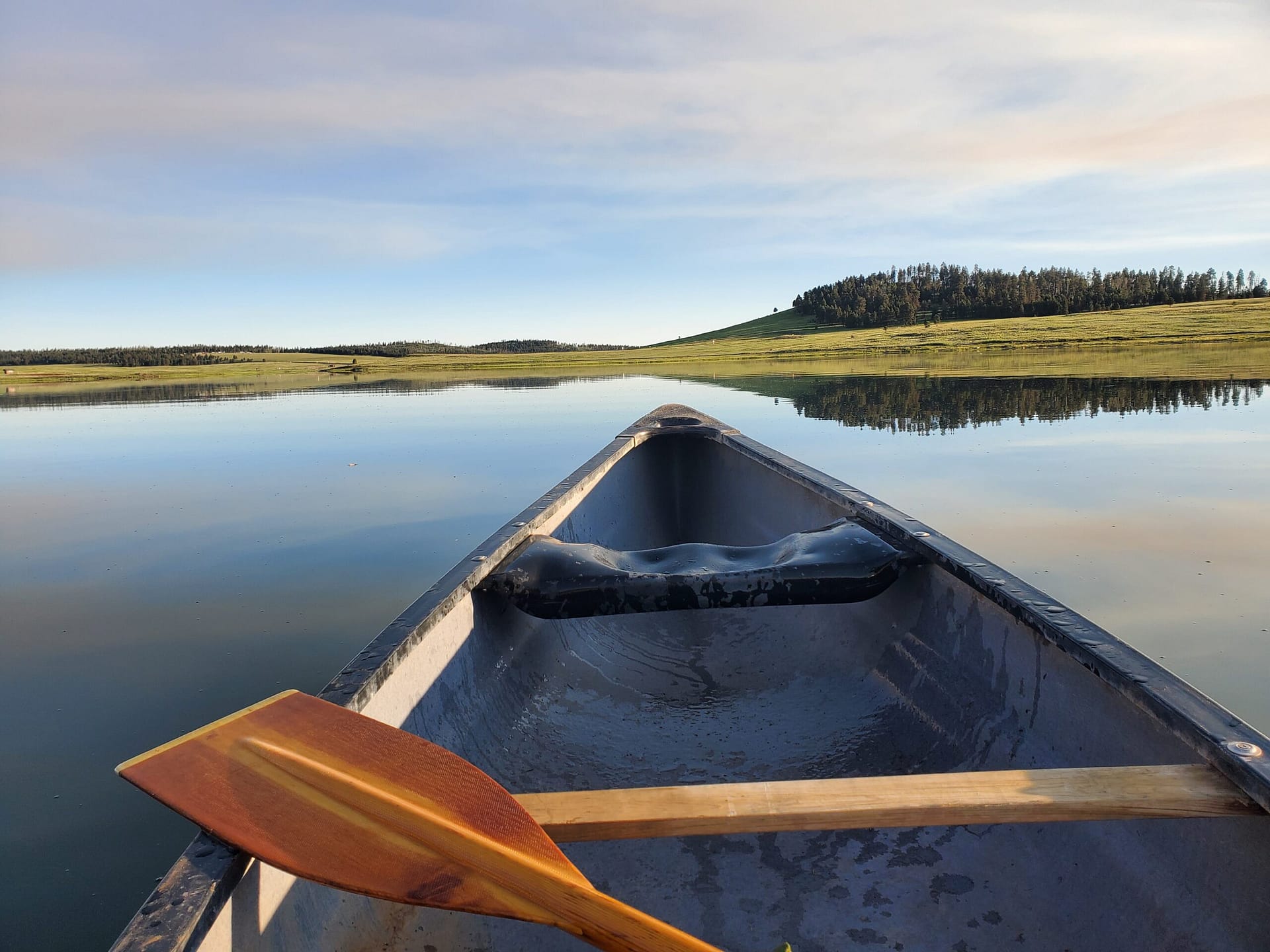 Early morning paddling on Crescent Lake near Greer, Arizona.